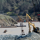 Construction crews are now dredging the river bed near Oroville Dam’s crippled spillway. (Image: AP)